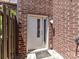 This brick home features a back door entrance with side window at 871 Academy St, Charlotte, NC 28205