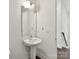 Bathroom with pedestal sink and modern fixtures at 871 Academy St, Charlotte, NC 28205