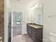 Bathroom featuring vanity with granite counters, with tiled floors at 871 Academy St, Charlotte, NC 28205