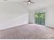 Spacious bedroom featuring large windows with natural light and a ceiling fan at 871 Academy St, Charlotte, NC 28205