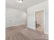 Neutral bedroom with closet and an ensuite bath at 871 Academy St, Charlotte, NC 28205