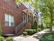 Row of brick townhomes with inviting walkways and well-maintained landscaping at 871 Academy St, Charlotte, NC 28205
