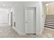 Hallway with tiled floors next to stairs at 871 Academy St, Charlotte, NC 28205