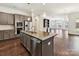 Modern kitchen with stainless appliances, granite countertops, island and hardwood floors at 871 Academy St, Charlotte, NC 28205