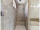 Modern, tiled shower with a glass door and a bench seat at 871 Academy St, Charlotte, NC 28205