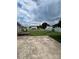 An expansive backyard boasts a garden, shed, and patio offering ample space for outdoor relaxation and entertainment at 8720 Lee St, Mount Pleasant, NC 28124