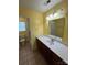 Bathroom vanity and countertop with a mirror at 8720 Lee St, Mount Pleasant, NC 28124