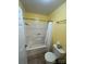 Bright bathroom features a shower-tub combo and toilet at 8720 Lee St, Mount Pleasant, NC 28124