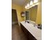 Bathroom vanity with a large mirror and storage at 8720 Lee St, Mount Pleasant, NC 28124