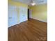 Bright bedroom with hardwood floors, ceiling fan, and closet at 8720 Lee St, Mount Pleasant, NC 28124