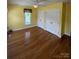 Bedroom featuring hardwood floors, a window, and double closets at 8720 Lee St, Mount Pleasant, NC 28124