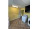 Well lit laundry room with appliances and storage at 8720 Lee St, Mount Pleasant, NC 28124