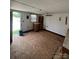 Interior room featuring white walls, a window, and wood elements, showing a simple and functional space at 8720 Lee St, Mount Pleasant, NC 28124