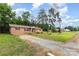Charming brick home with a well-manicured lawn and red shutters adds curb appeal at 925 Rock Grove Church Rd, Salisbury, NC 28146