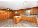 Charming kitchen open to the living room with wood paneled walls and vinyl floors at 925 Rock Grove Church Rd, Salisbury, NC 28146