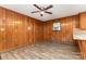 Cozy living room featuring wood paneled walls and vinyl floors at 925 Rock Grove Church Rd, Salisbury, NC 28146