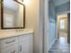Bathroom featuring a vanity with marble countertop, modern fixtures, and neutral colors at 9426 Greyson Ridge Dr, Charlotte, NC 28277