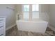 Modern bathroom featuring a standalone tub, stylish faucet, and marble accents at 9426 Greyson Ridge Dr, Charlotte, NC 28277