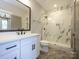 Beautiful bathroom featuring marble floors and shower and white cabinets at 9426 Greyson Ridge Dr, Charlotte, NC 28277