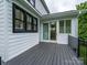 Spacious deck with dark-gray wood and sliding-glass doors at 9426 Greyson Ridge Dr, Charlotte, NC 28277