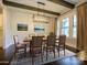 A cozy dining room with hardwood floors, a chandelier, and comfortable seating at 9426 Greyson Ridge Dr, Charlotte, NC 28277