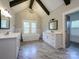 A luxurious main bathroom with dual vanities, a standalone tub, and abundant natural light at 9426 Greyson Ridge Dr, Charlotte, NC 28277