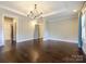 A bright and airy main bedroom featuring large windows, neutral walls, and hardwood floors at 9426 Greyson Ridge Dr, Charlotte, NC 28277
