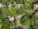 An aerial view shows mature landscaping and surrounding homes in this quiet neighborhood at 9900 Colvard Cir, Charlotte, NC 28269