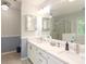 Bright bathroom with double vanity, quartz countertop, and glass shower at 9900 Colvard Cir, Charlotte, NC 28269