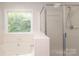 Bathroom with tub and separate glass-enclosed shower at 9900 Colvard Cir, Charlotte, NC 28269
