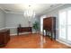 Charming dining room with hardwood floors, wainscoting, and a stylish chandelier at 9900 Colvard Cir, Charlotte, NC 28269