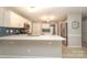 Bright kitchen with white cabinets, stainless steel appliances, and marble countertops at 9900 Colvard Cir, Charlotte, NC 28269