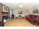 Spacious living room featuring a brick fireplace, vaulted ceiling, and lots of seating at 9900 Colvard Cir, Charlotte, NC 28269