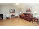 Cozy living room with a leather sofa, hardwood floors, and stylish decorations at 9900 Colvard Cir, Charlotte, NC 28269