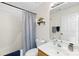 Clean bathroom with a shower-tub combo, vanity sink, and neutral finishes at 10908 Delsing Ct, Charlotte, NC 28214