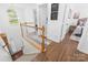 Bright foyer features hardwood floors, white trim, and staircase at 10908 Delsing Ct, Charlotte, NC 28214