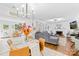 Open-concept living area with a view of the fireplace, modern lighting, and decor at 10908 Delsing Ct, Charlotte, NC 28214