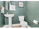 Stylish half-bath with modern pedestal sink and tasteful decor at 11043 Stetler St, Charlotte, NC 28204