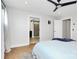 Primary bedroom boasts hardwood floors, ceiling fan, and ensuite bathroom access at 11043 Stetler St, Charlotte, NC 28204