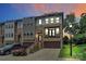 Modern townhouse boasting a brick facade, a two-car garage, and a private rooftop terrace perfect for entertaining at 11043 Stetler St, Charlotte, NC 28204