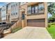 Townhouse with a brick facade, a two-car garage, and well-manicured landscaping enhancing its curb appeal at 11043 Stetler St, Charlotte, NC 28204