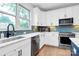 Stylish kitchen with white cabinets, stainless steel appliances, and modern countertops at 11043 Stetler St, Charlotte, NC 28204