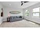 Spacious living area features a ceiling fan and plenty of natural light at 11043 Stetler St, Charlotte, NC 28204