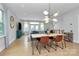 Open-concept living space with dining area and modern lighting fixtures at 11043 Stetler St, Charlotte, NC 28204