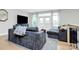 Cozy living room featuring modern furniture, hardwood floors, and plenty of natural light at 11043 Stetler St, Charlotte, NC 28204