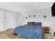 Comfortable main bedroom with neutral walls, hardwood floors, and wicker nightstands at 11043 Stetler St, Charlotte, NC 28204