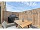 Outdoor patio features a grill and wicker seating, perfect for entertaining at 11043 Stetler St, Charlotte, NC 28204