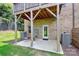 Cozy covered patio with brick exterior, concrete floor, and outdoor seating, ideal for relaxing at 11043 Stetler St, Charlotte, NC 28204