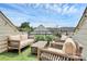 Relaxing rooftop deck with outdoor seating and artificial turf at 11043 Stetler St, Charlotte, NC 28204