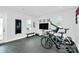 Spacious workout room with stationary bikes, free weights, and television at 11043 Stetler St, Charlotte, NC 28204